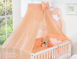 Duża moskitiera do łóżeczka dziecięcego z szyfonu z wiszącymi serduszkami i kokardką - brzoskwiniowa